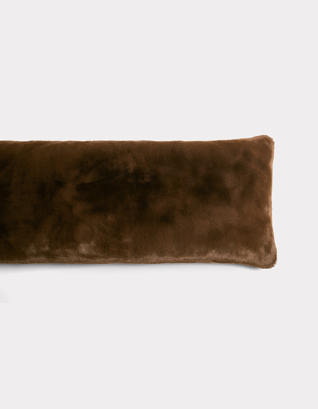 The Cozy Earth Cuddle Pillow is a long, rectangular, dark brown plush pillow with a soft, fuzzy texture, displayed on a plain white background.|Color:Espresso |Size:Body