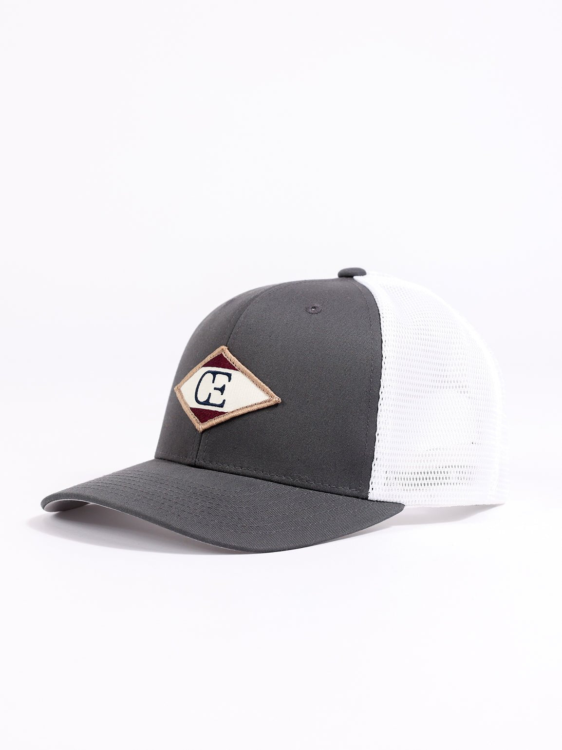 Studio shot of charcoal/white diamond mesh trucker hat showing the side |Color:Charcoal/White