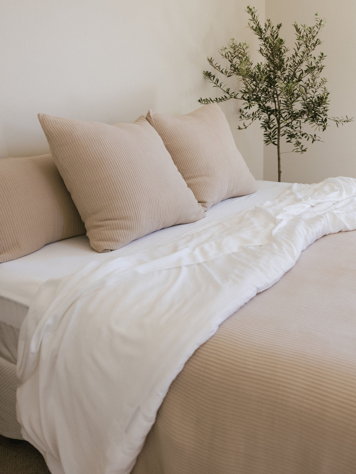 Driftwood coverlet shams and quilt on a bed with white bedding |Color:Driftwood