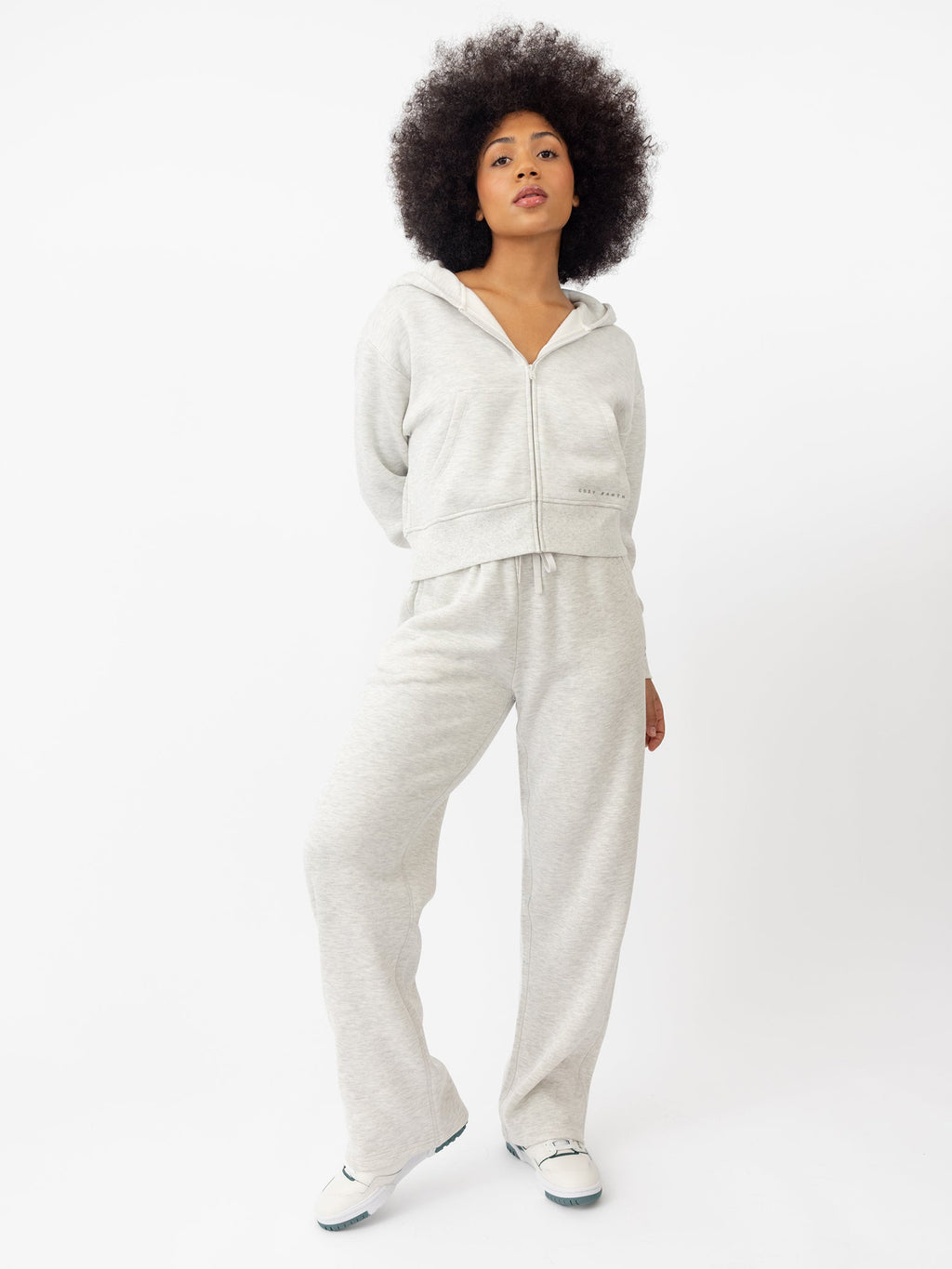 Woman wearing Heather Grey CityScape Cropped Full Zip with white background |Color: Heather Grey