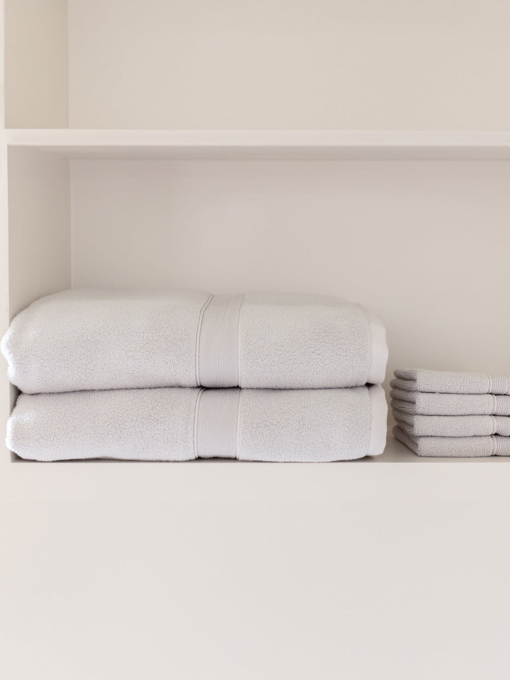 Light grey luxe bath sheets and washcloths on shelf |Color:Light Grey