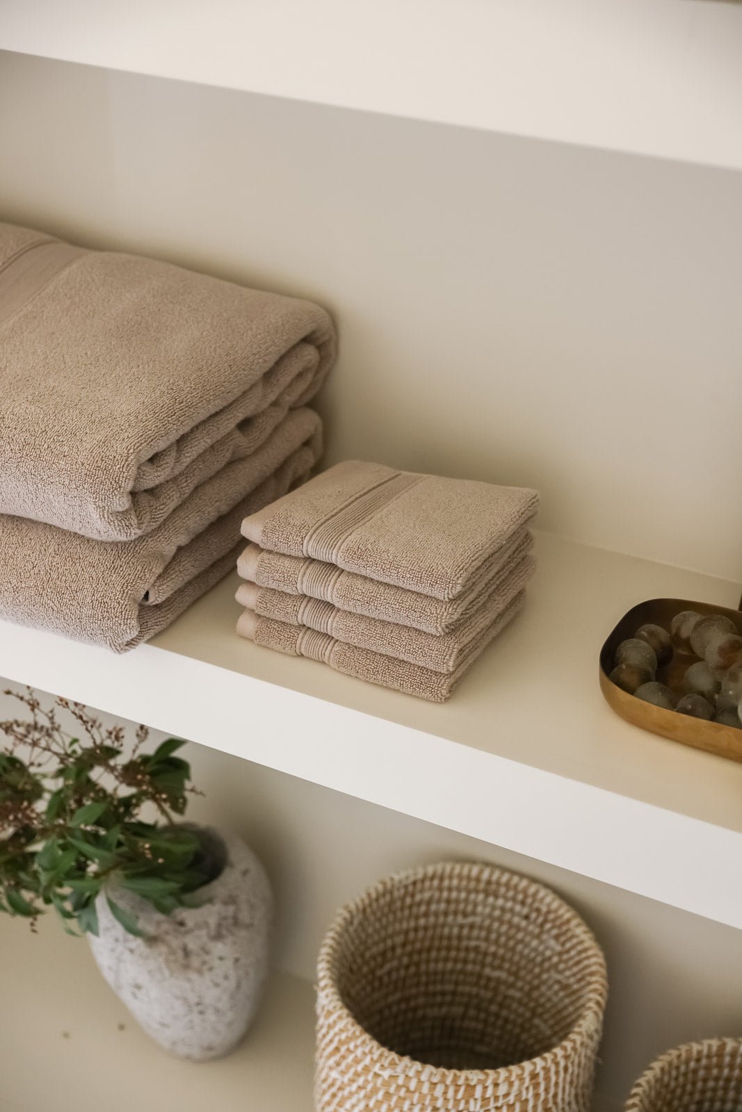 Sand washcloths folded on counter |Color:Sand