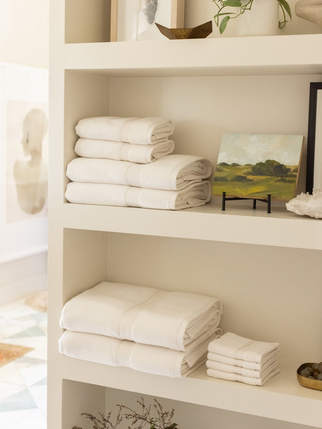 Complete luxe bath bundle folded on shelves |Color:Seashell