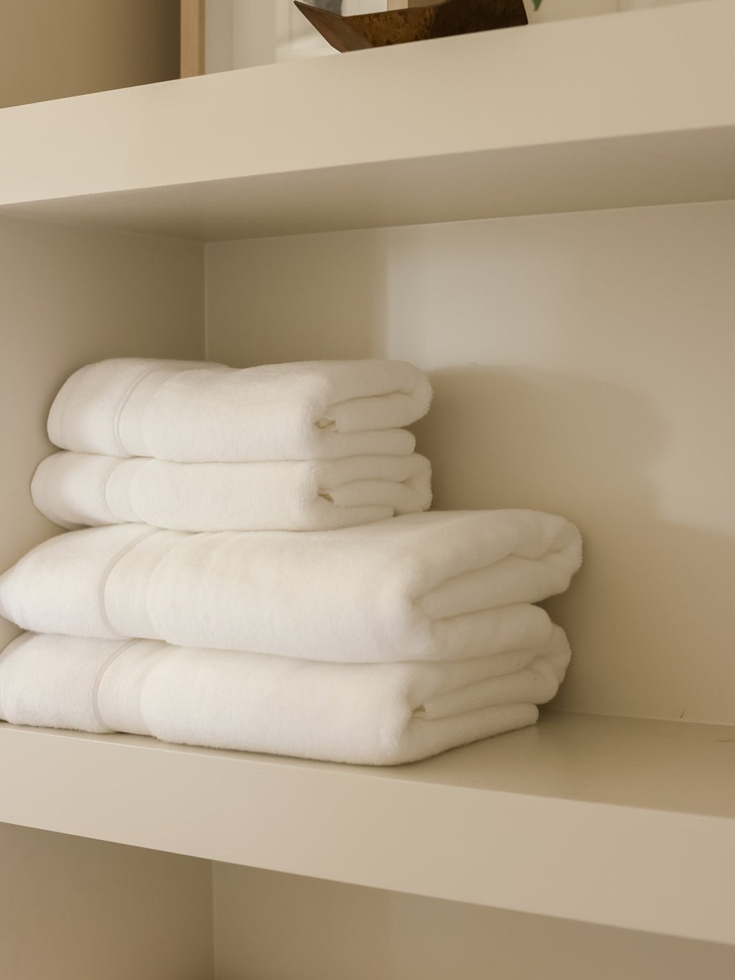 White luxe bath towels and hand towels on shelf |Color:White