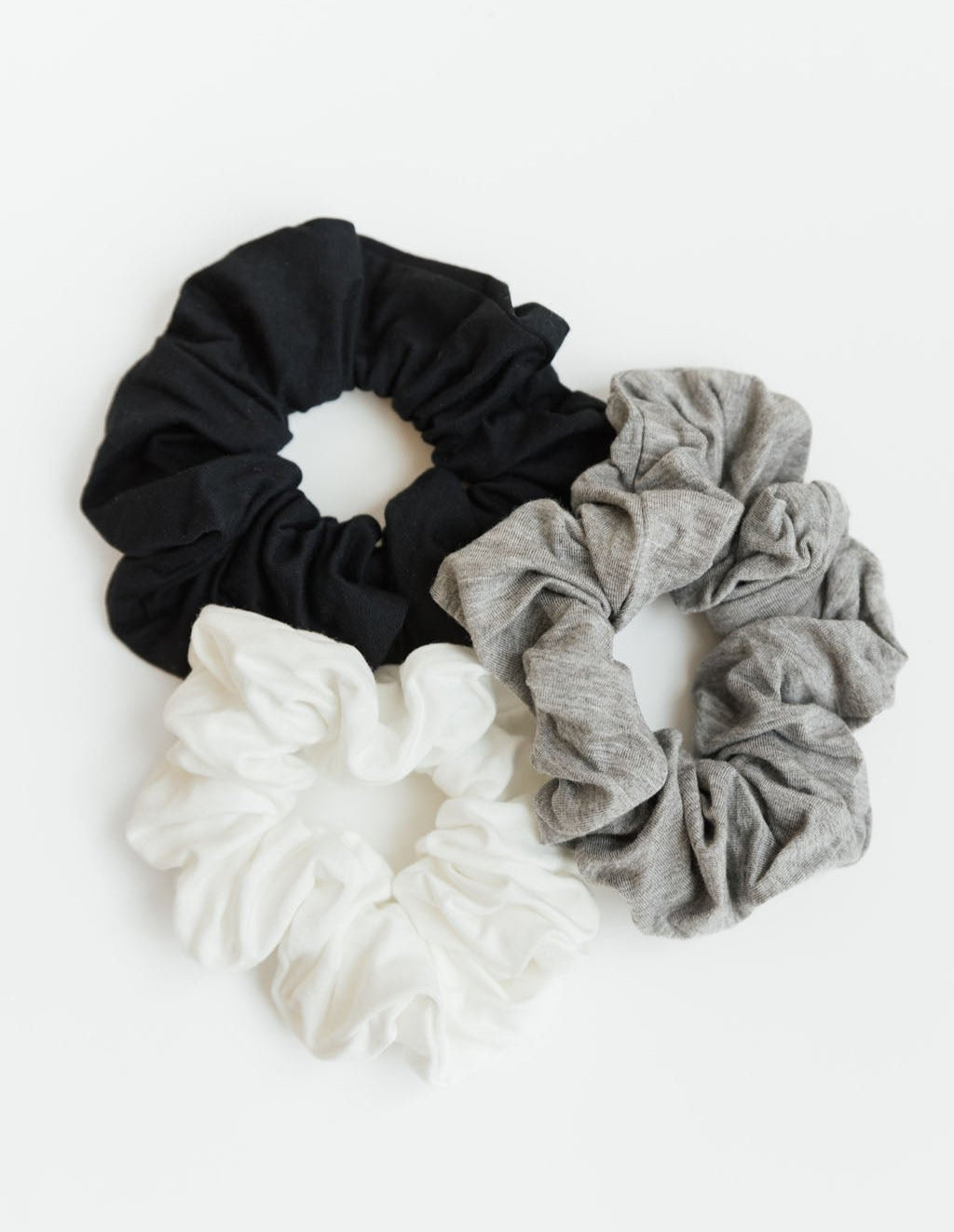 A group of three stretch knit scrunchies in Black, Ivory, and Grey |Color:Black/Ivory/Grey