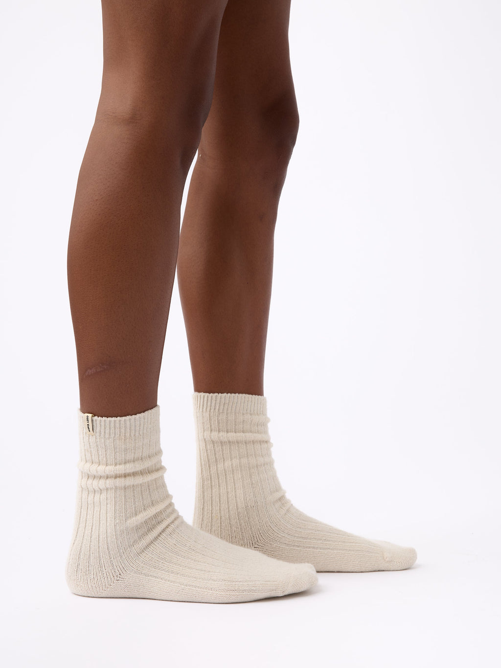 Person wearing Cozy Earth Plush Lounge Calf Sock 1-Pack in Alabaster |Color:Alabaster