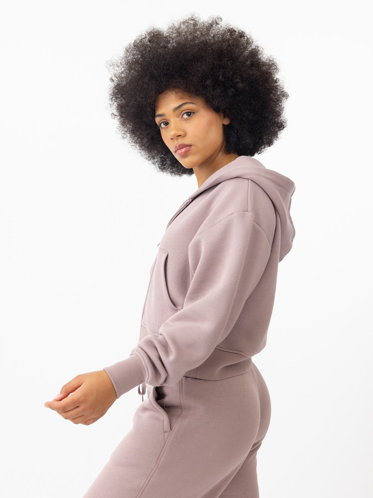 Woman wearing Dusty Orchid CityScape Cropped Full Zip with white background |Color: Dusty Orchid