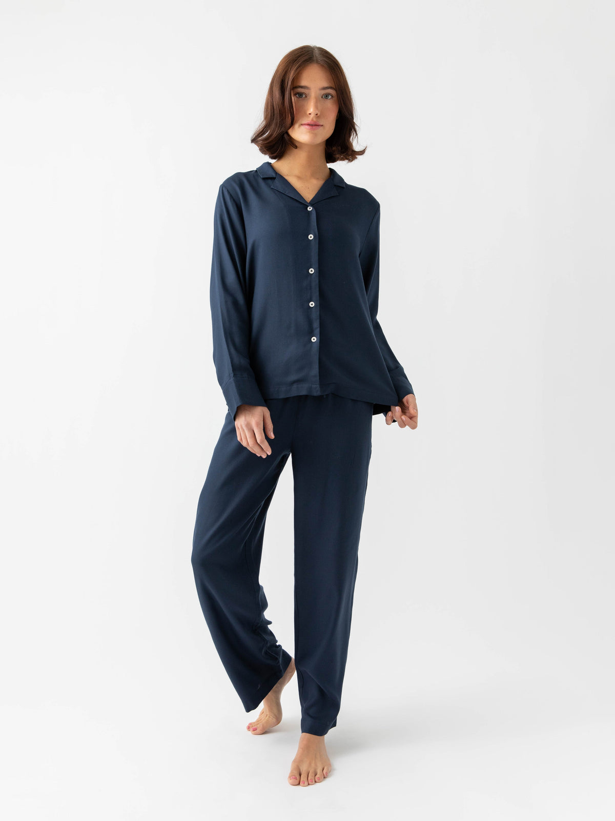 Woman wearing Eclipse soft woven pajamas with white background |Color:Eclipse