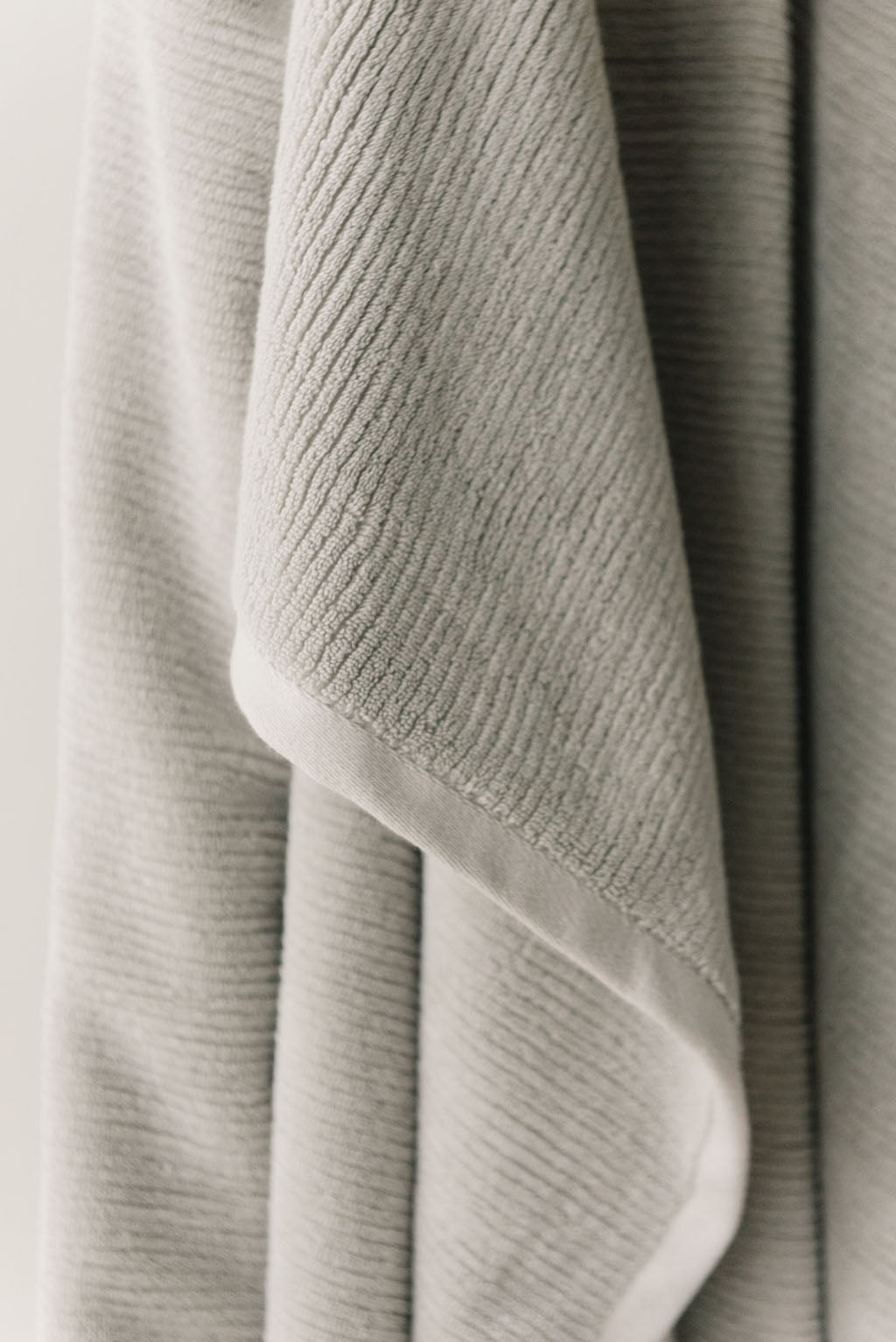 Ribbed Terry Bath Sheets in the color Light Grey. Photo of the towel is taken close up. |Color:Light Grey
