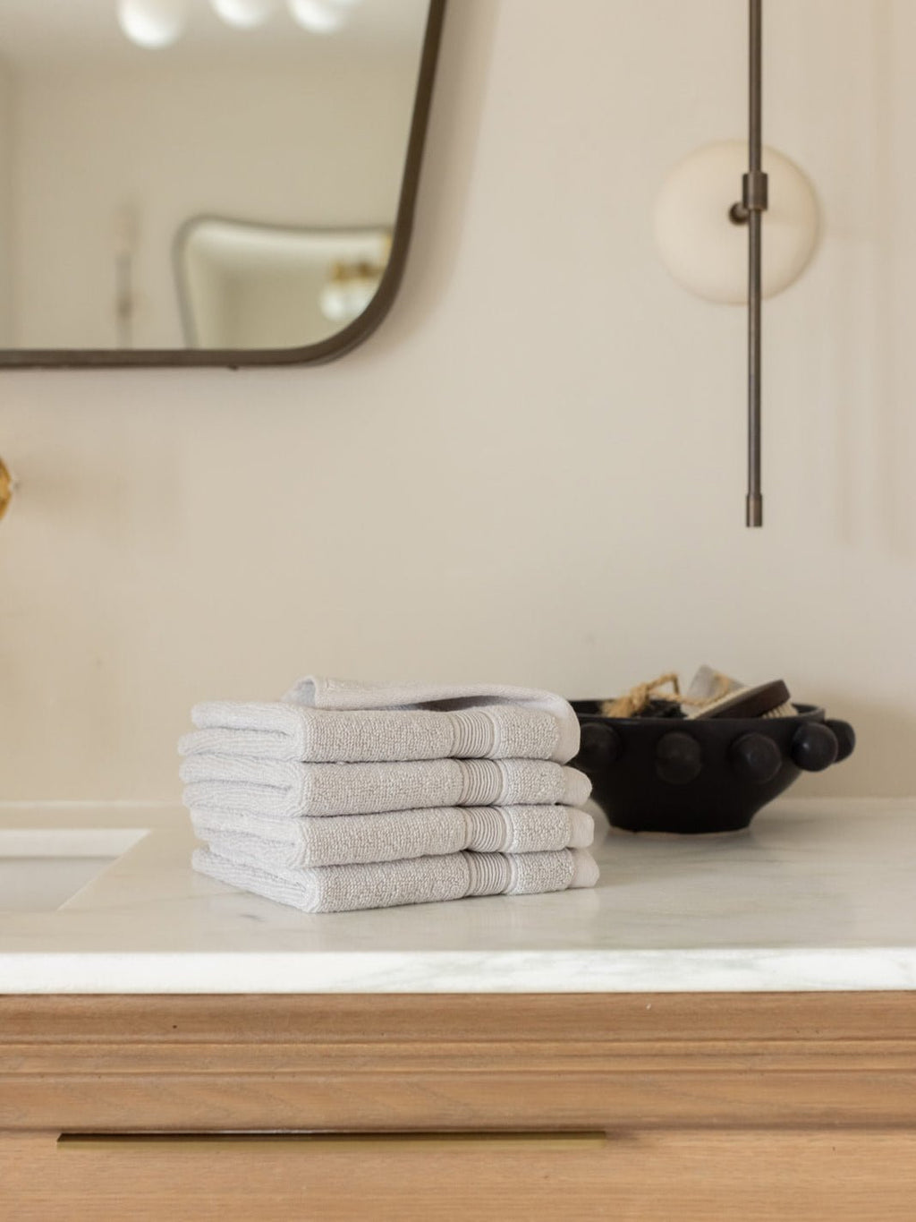 Light grey washcloths folded on bathroom counter |Color:Light Grey