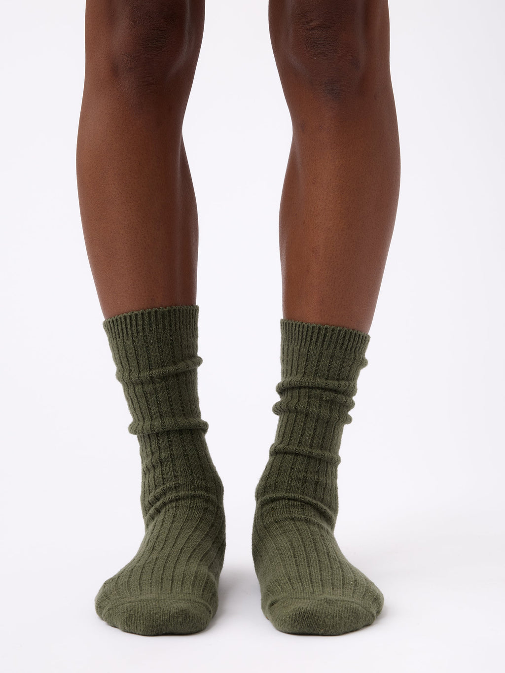 Person wearing Cozy Earth Plush Lounge Calf Sock 1-Pack in Olive |Color:Olive
