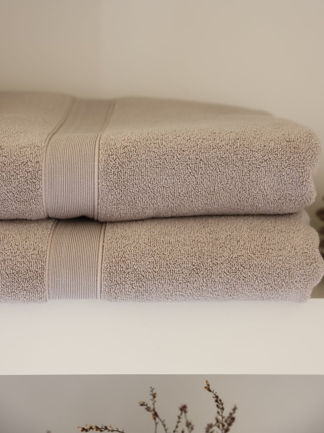 Close up of folded sand luxe bath towels on shelf |Color:Sand