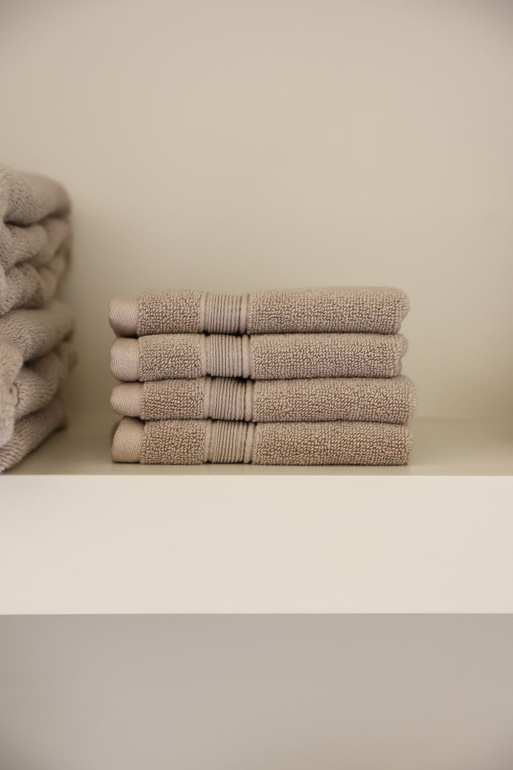 Sand washcloths folded on shelf |Color:Sand