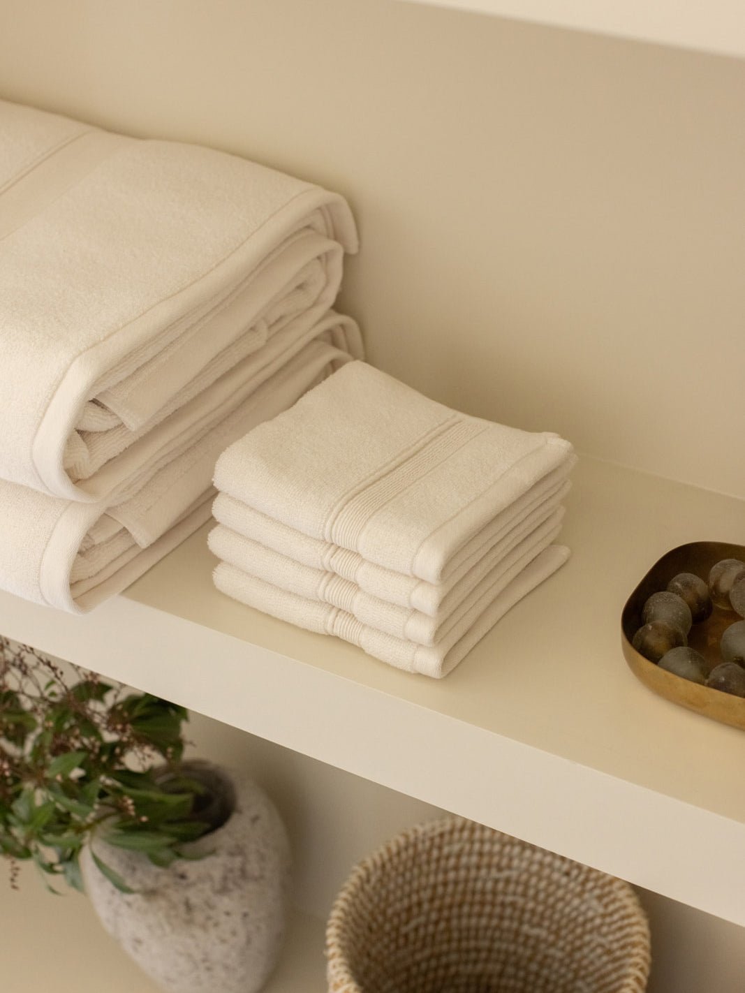 Seashell washcloths folded on shelf |Color:Seashell