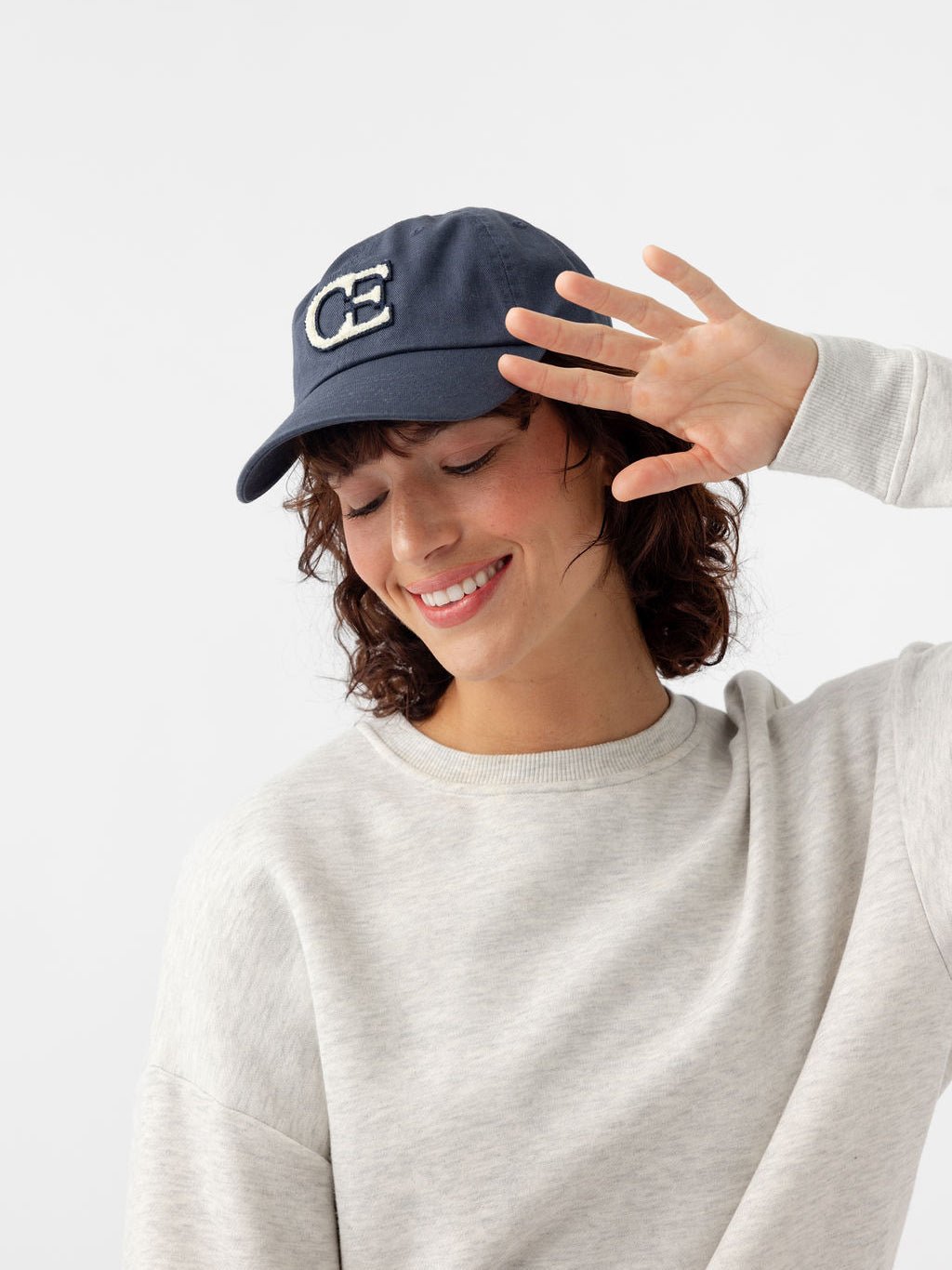 Woman looking down wearing washed navy vintage cap |Color:Washed Navy