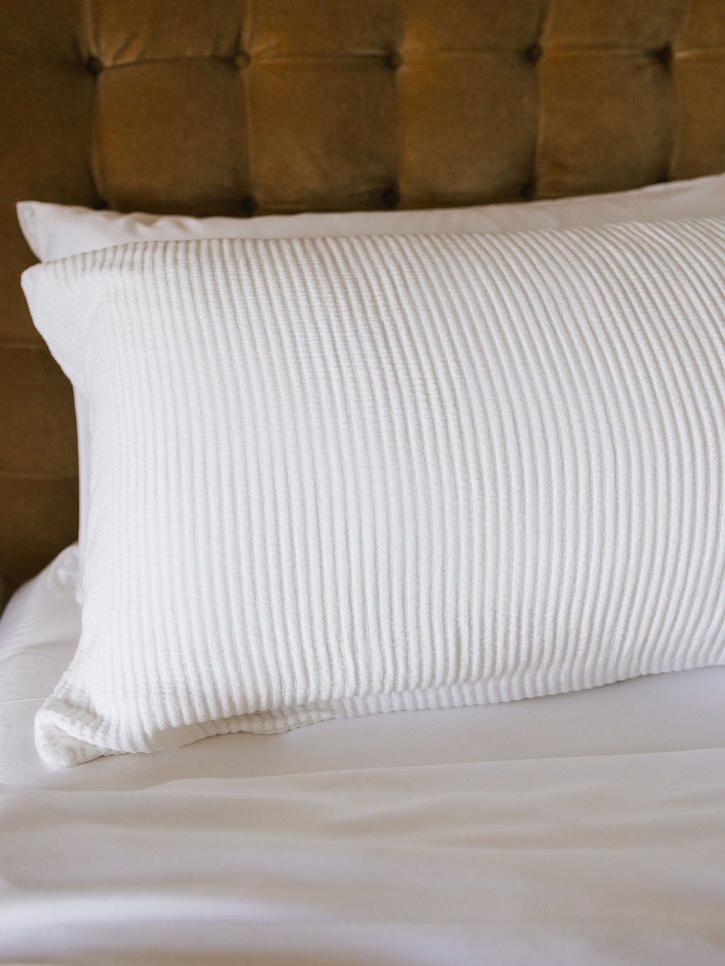 White coverlet sham on bed close up |Color:White