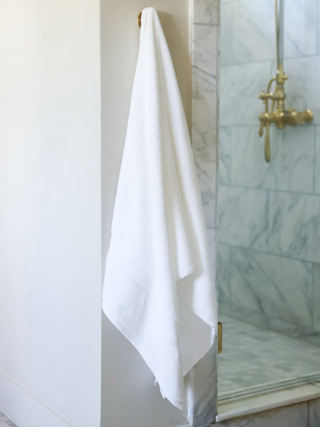 White luxe bath sheet hanging next to the shower |Color:White