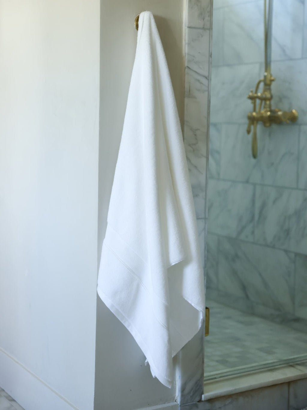 White luxe bath sheet hanging next to shower |Color:White