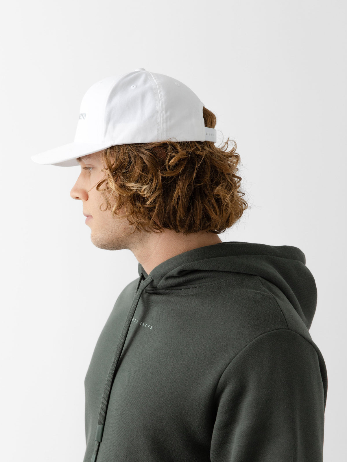 A man wearing a White cap on a white background |Color:White/Stone