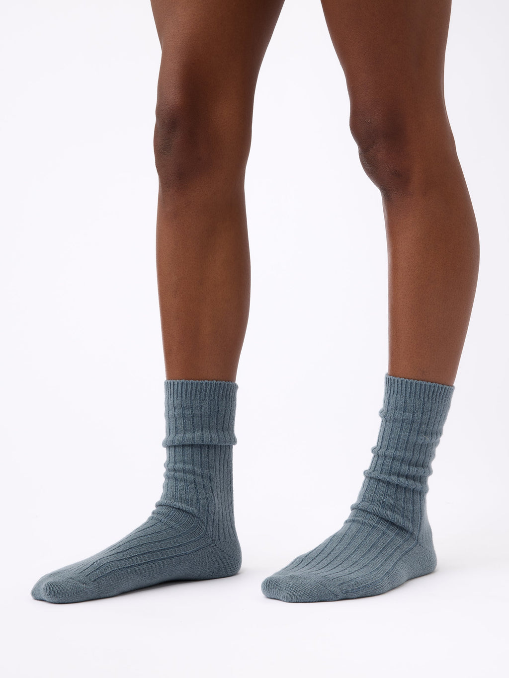 Person wearing Cozy Earth Plush Lounge Calf Sock 1-Pack in Deep Blue |Color:Deep Blue