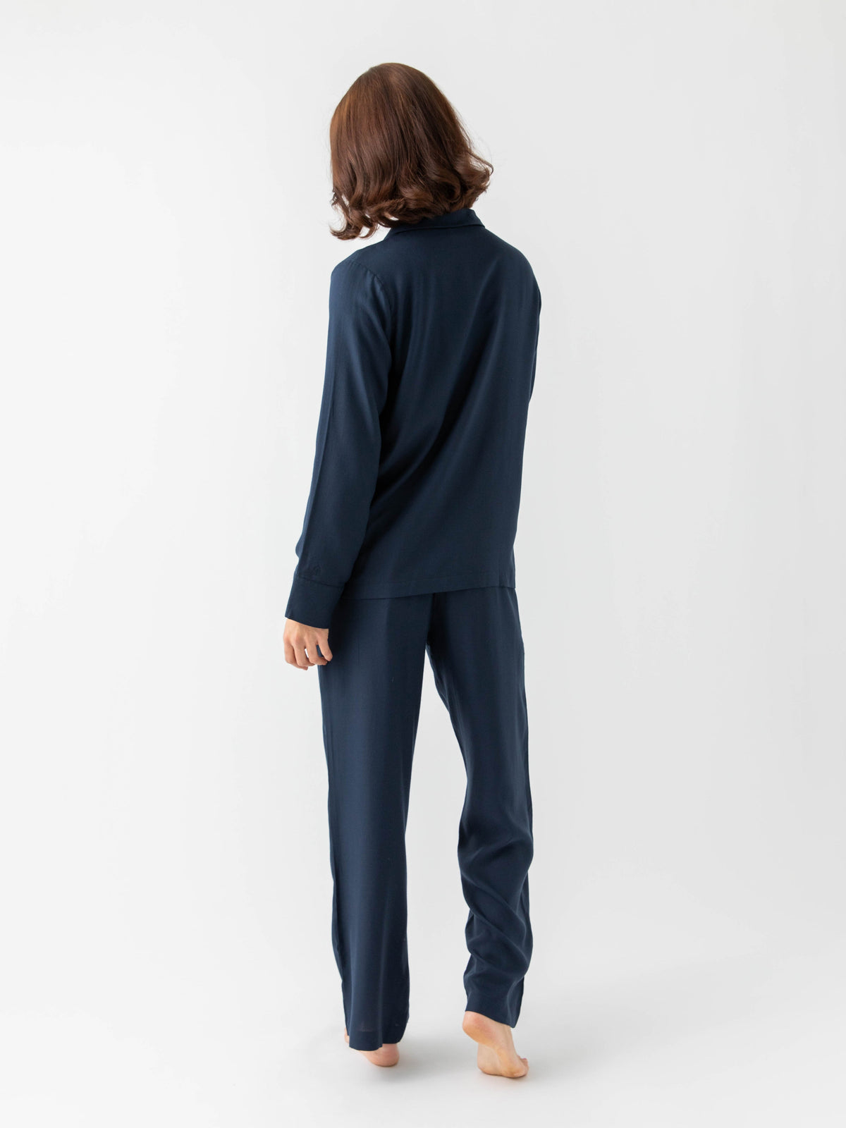 Woman wearing Eclipse soft woven pajamas with white background |Color:Eclipse