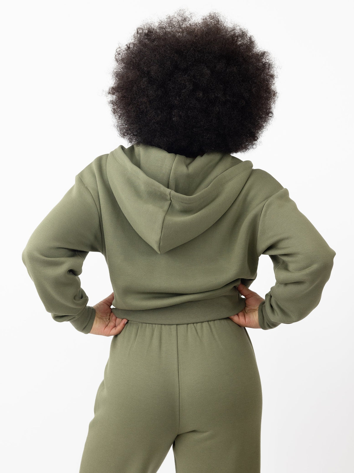 Woman wearing Juniper CityScape Cropped Full Zip with white background |Color: Juniper
