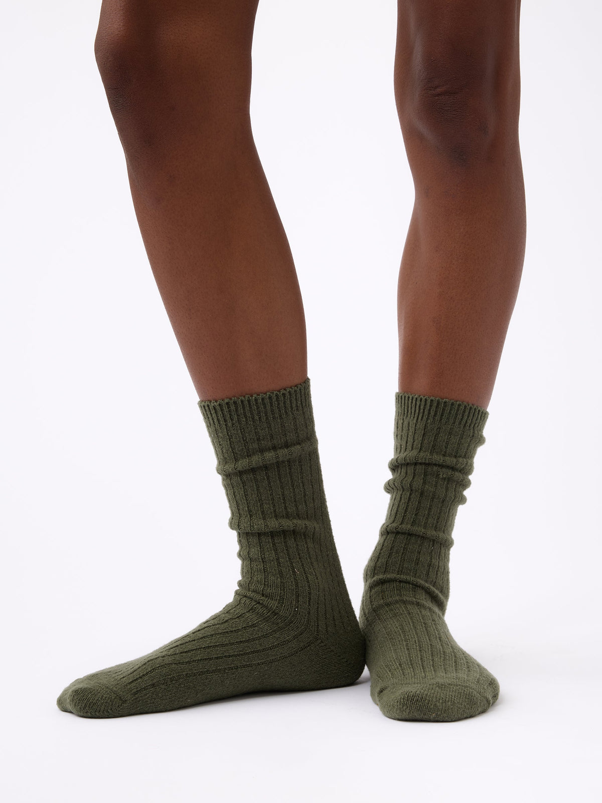 Person wearing Cozy Earth Plush Lounge Calf Sock 1-Pack in Olive |Color:Olive