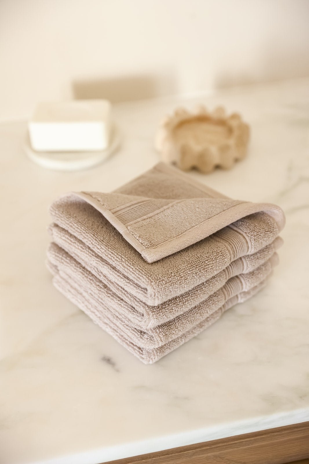 Sand washcloths folded on bathroom counter |Color:Sand
