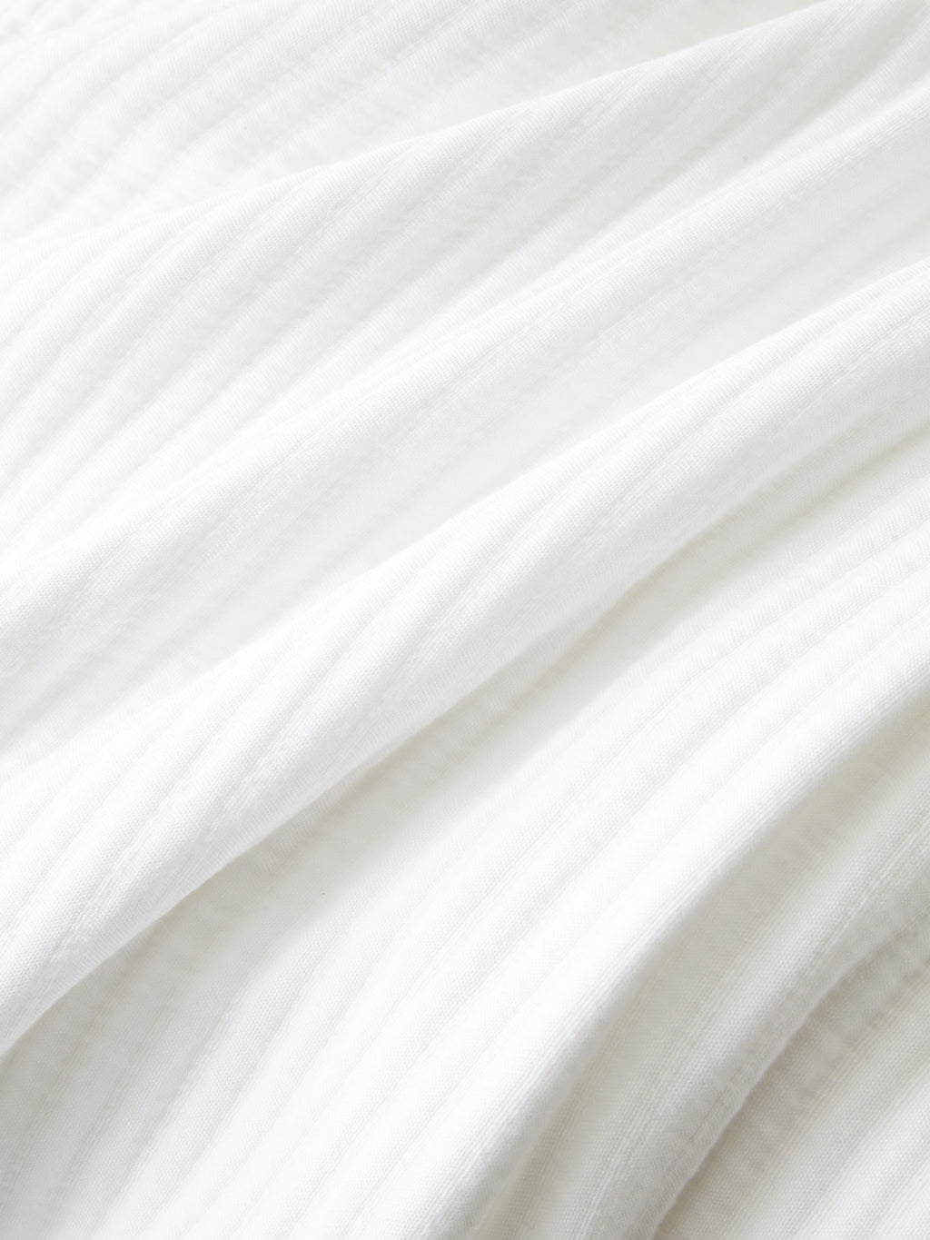 Close up of white coverlet fabric |Color:White