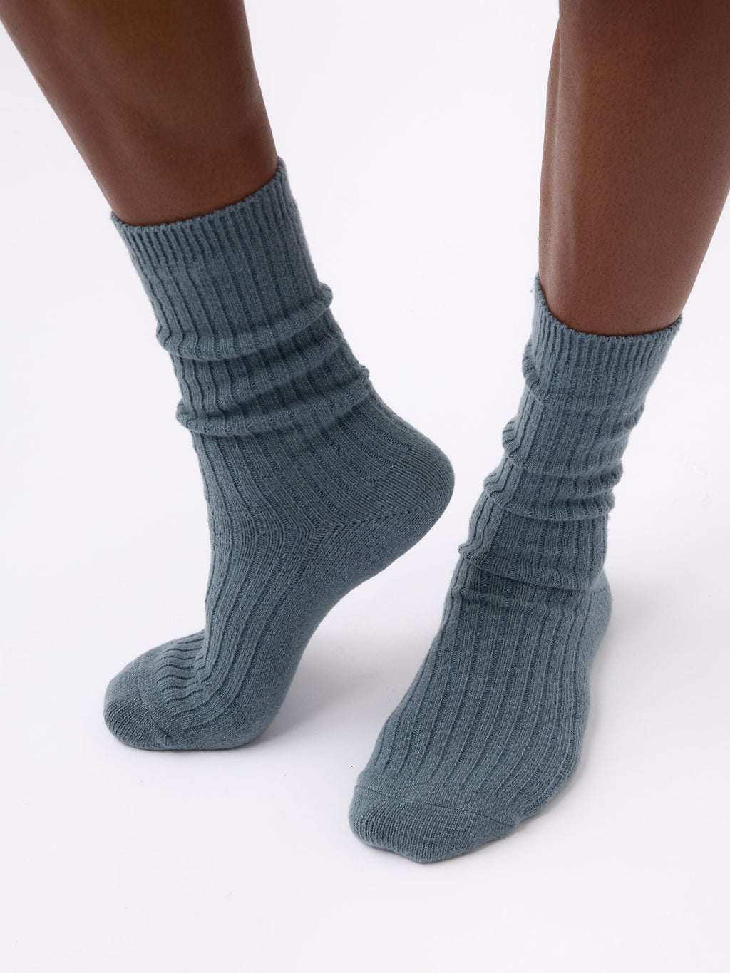 Person wearing Cozy Earth Plush Lounge Calf Sock 1-Pack in Deep Blue |Color:Deep Blue