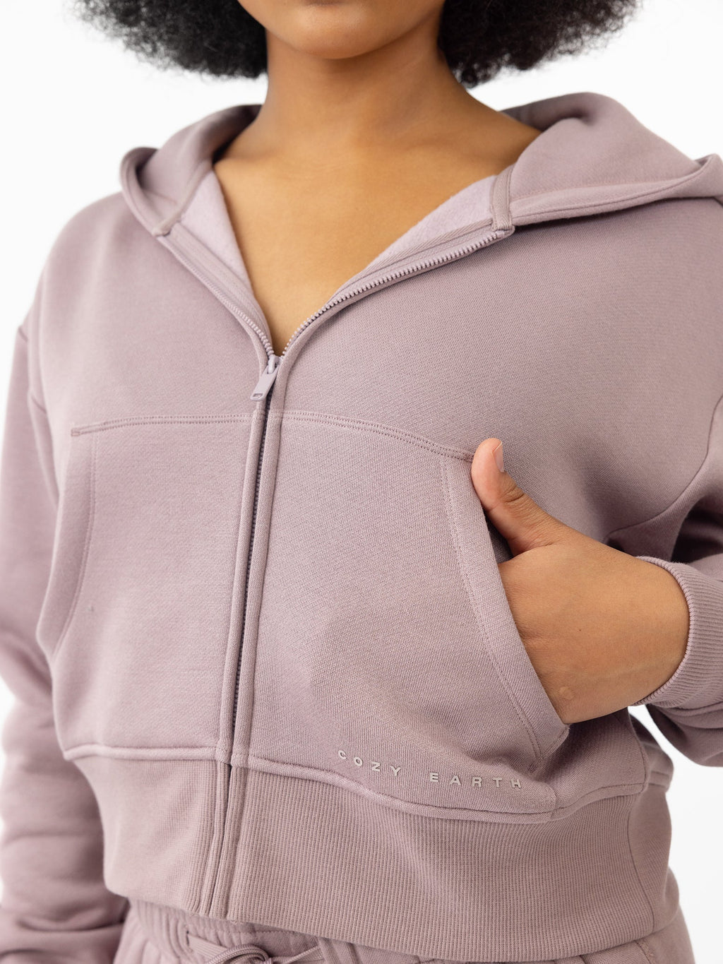 Woman wearing Dusty Orchid CityScape Cropped Full Zip with white background |Color: Dusty Orchid