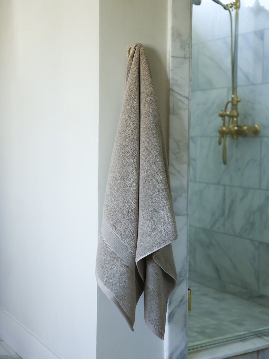 Sand luxe bath sheet hanging next to shower |Color:Sand