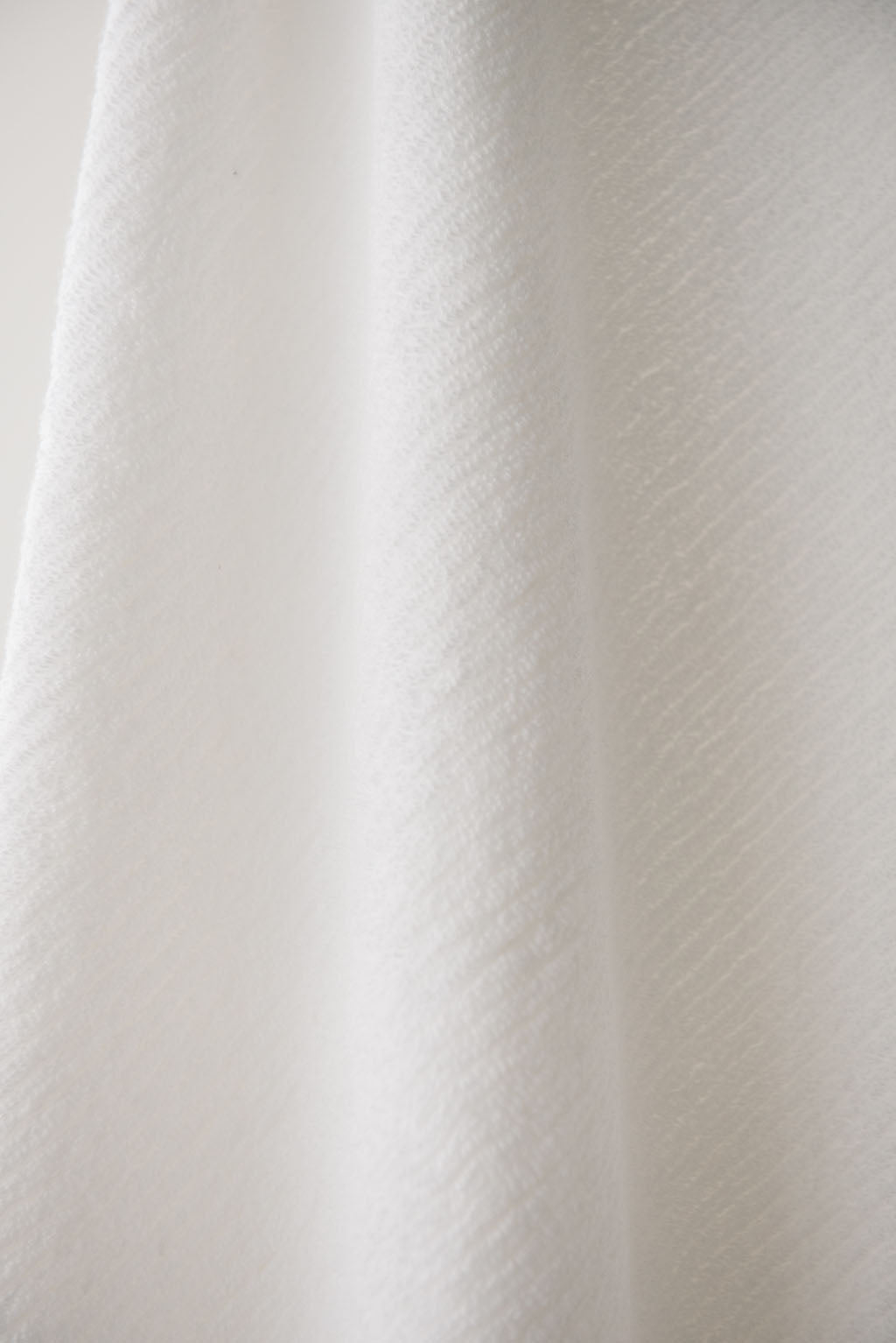 Ribbed Terry Bath Sheets in the color White. Photo of the towel is taken close up. |Color:White