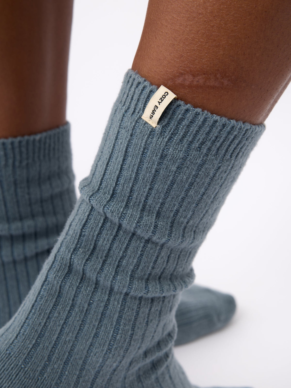 Close-up of the tag on Cozy Earth Plush Lounge Calf Sock 1-Pack in Deep Blue |Color:Deep Blue