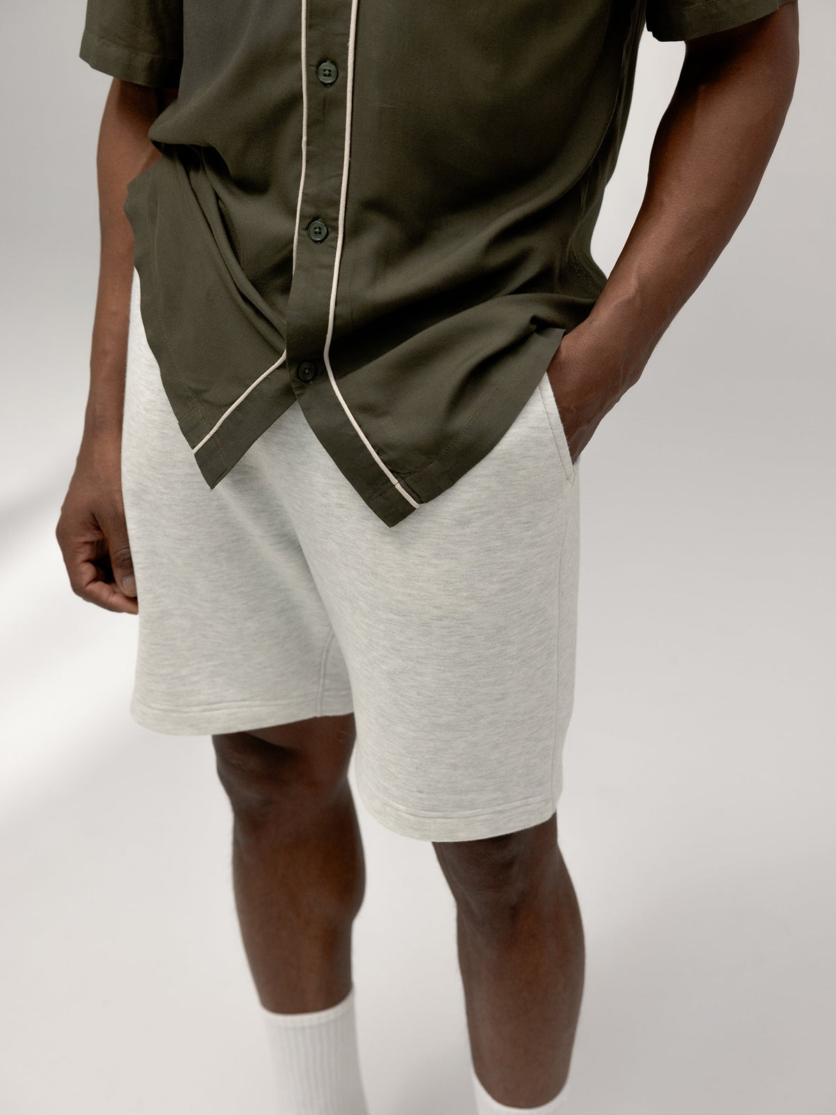 Close up of man wearing heather grey cityscape shorts |Color:Heather Grey