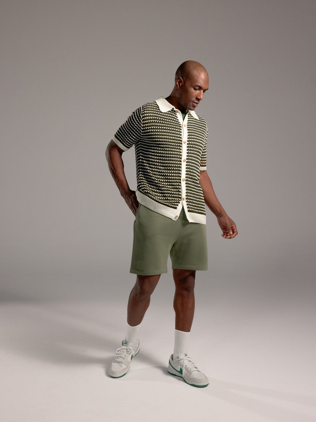 Man wearing Juniper CityScape Shorts with grey background |Color: Juniper