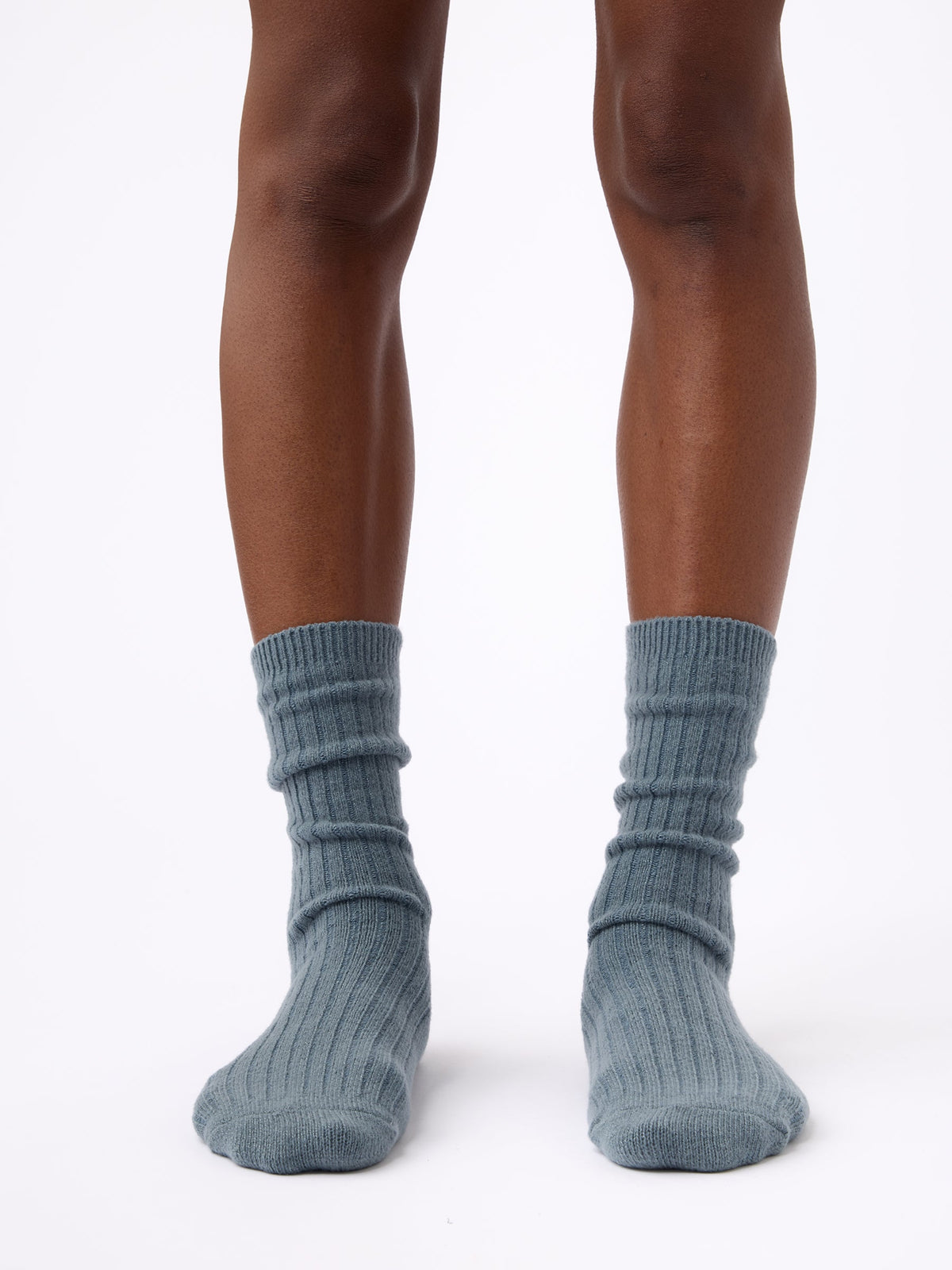 Person wearing Cozy Earth Plush Lounge Calf Sock in Deep Blue |Color:Eclipse/Deep Blue/Smokey Blue