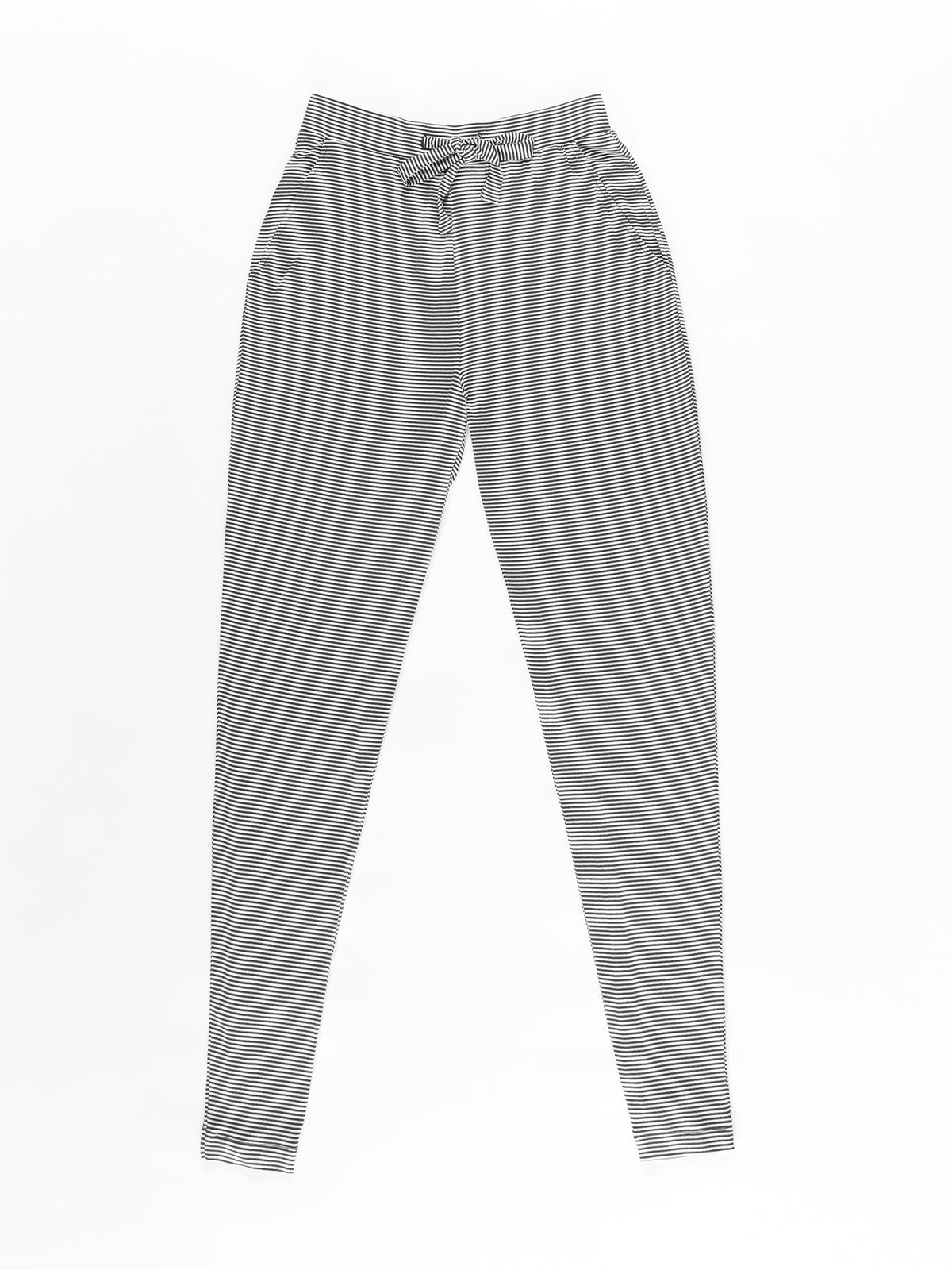 The Women's Bamboo Stretch-Knit Tapered Pant by Cozy Earth, featuring a subtle grey striped pattern, an elastic waistband with a drawstring tie, is laid flat on a white background. |Color:Eclipse Mini Stripe