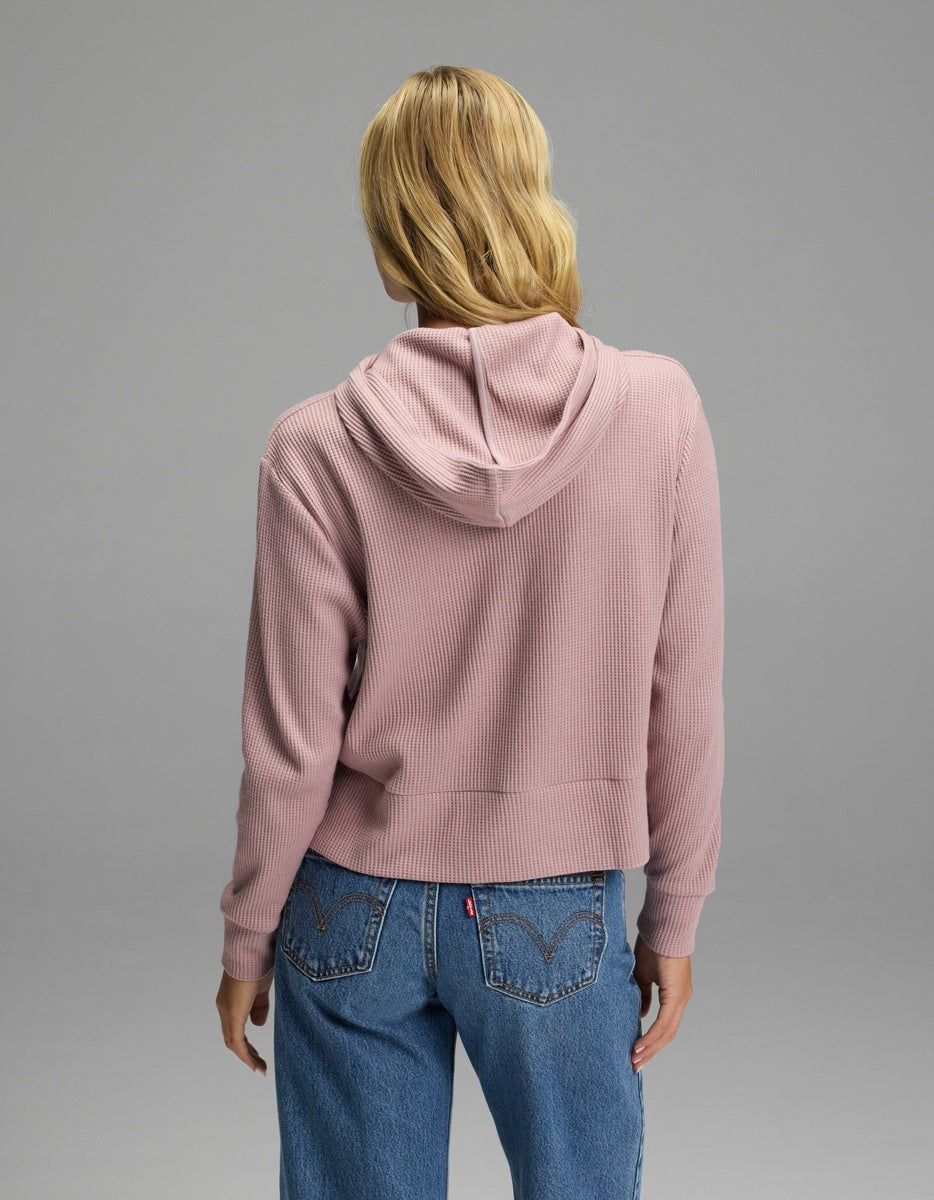 A person from behind wearing a mauve, long-sleeve Cozy Earth Women’s Blake Waffle Hoodie and blue jeans.|Color:Viola