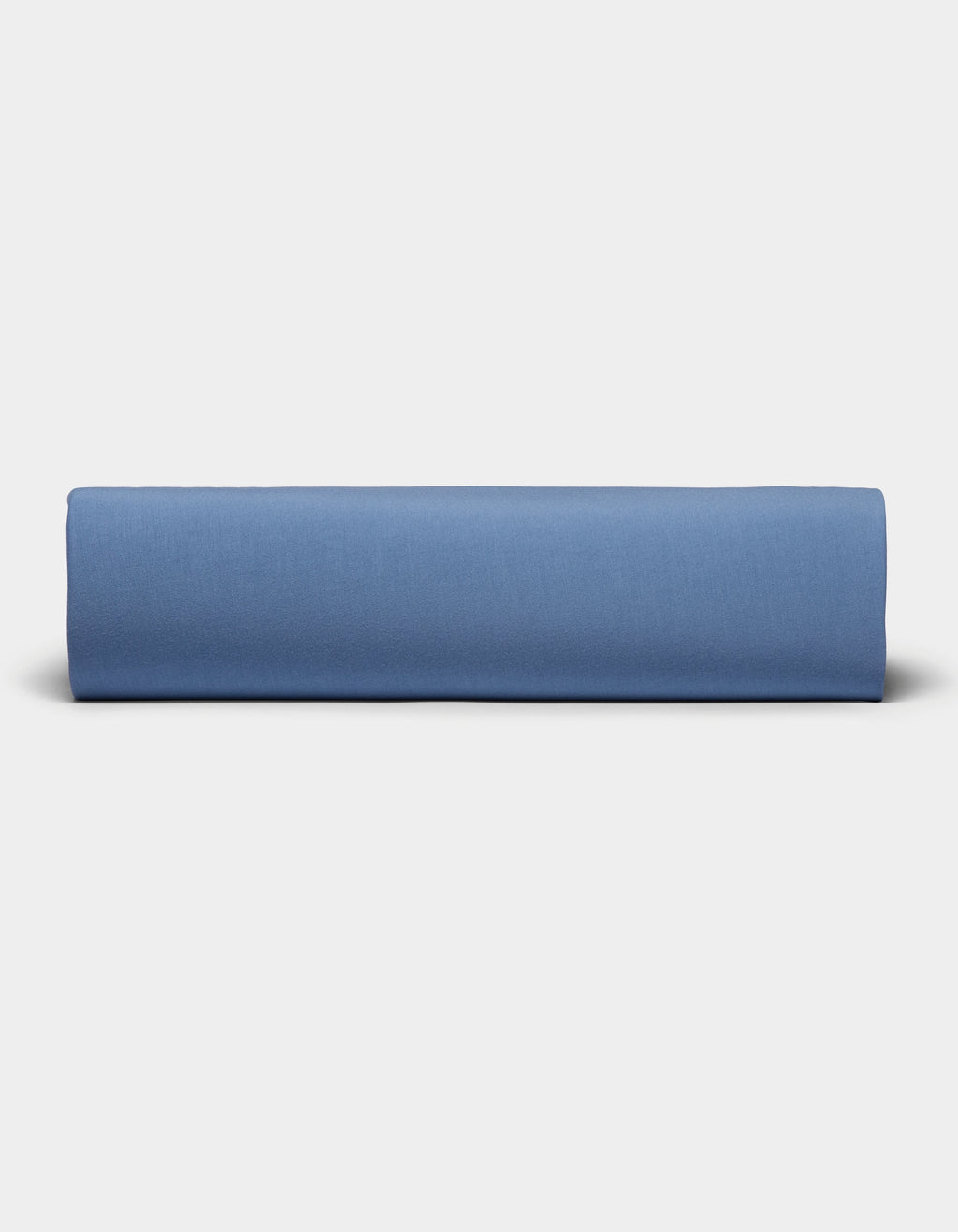 A neatly folded Bamboo Jersey Sheet Set by Cozy Earth is displayed against a plain, light gray background.|Color:Sailor