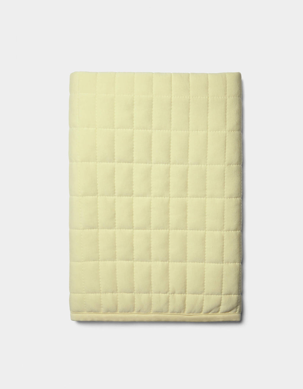 The Cozy Earth Bamboo Jersey Quilted Shams in light yellow, featuring a square grid pattern, are neatly displayed against a plain white background.|Color:Meringue