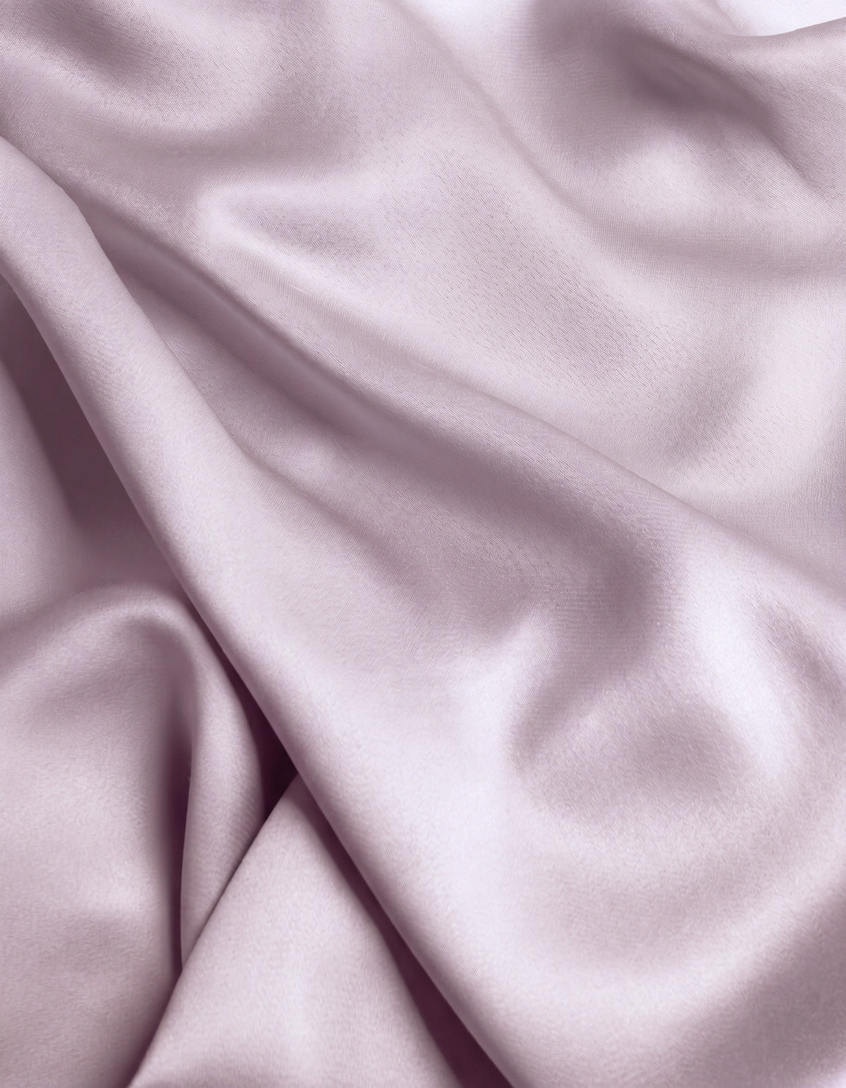 Close-up of the Cozy Earth Bamboo Flat Sheet in a smooth, light lavender shade, featuring gentle folds and a soft sheen that highlights its silky texture.|Color:Lavender