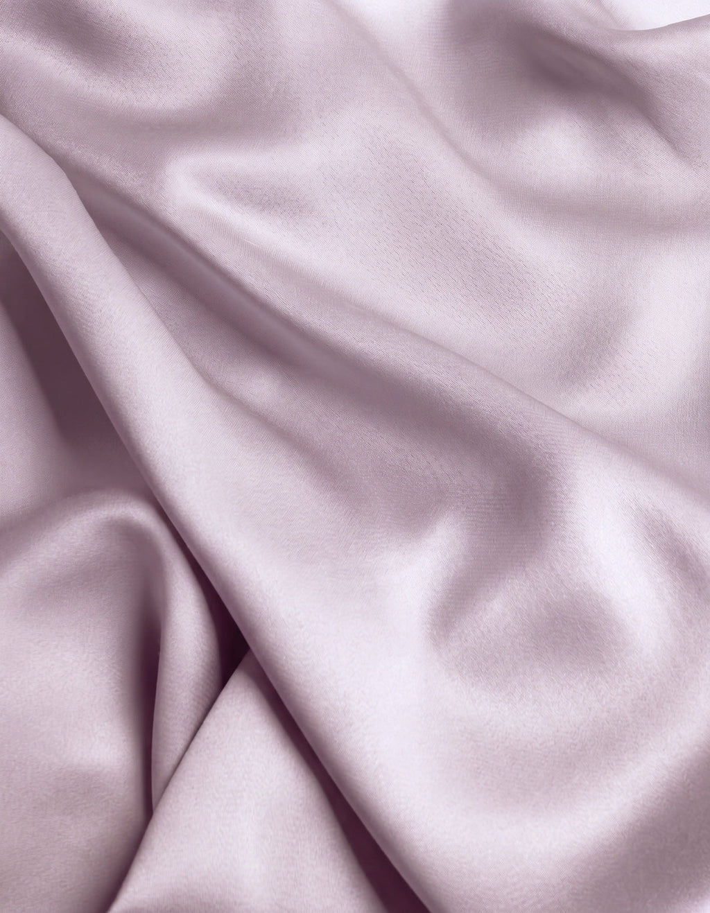 Close-up of the Cozy Earth Bamboo Flat Sheet in a smooth, light lavender shade, featuring gentle folds and a soft sheen that highlights its silky texture.|Color:Lavender