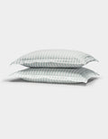 Two Cozy Earth Soft-Wash Cotton Quilted Shams in white with light blue and gray stripes are stacked together against a plain white background.|Color:River and Sea Salt Stripe