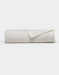 The Waterfront Grid Matelasse Blanket by Cozy Earth is shown neatly folded with a textured, crinkled surface against a plain light background. One corner is flipped over to reveal the underside.|Color:Sea Salt