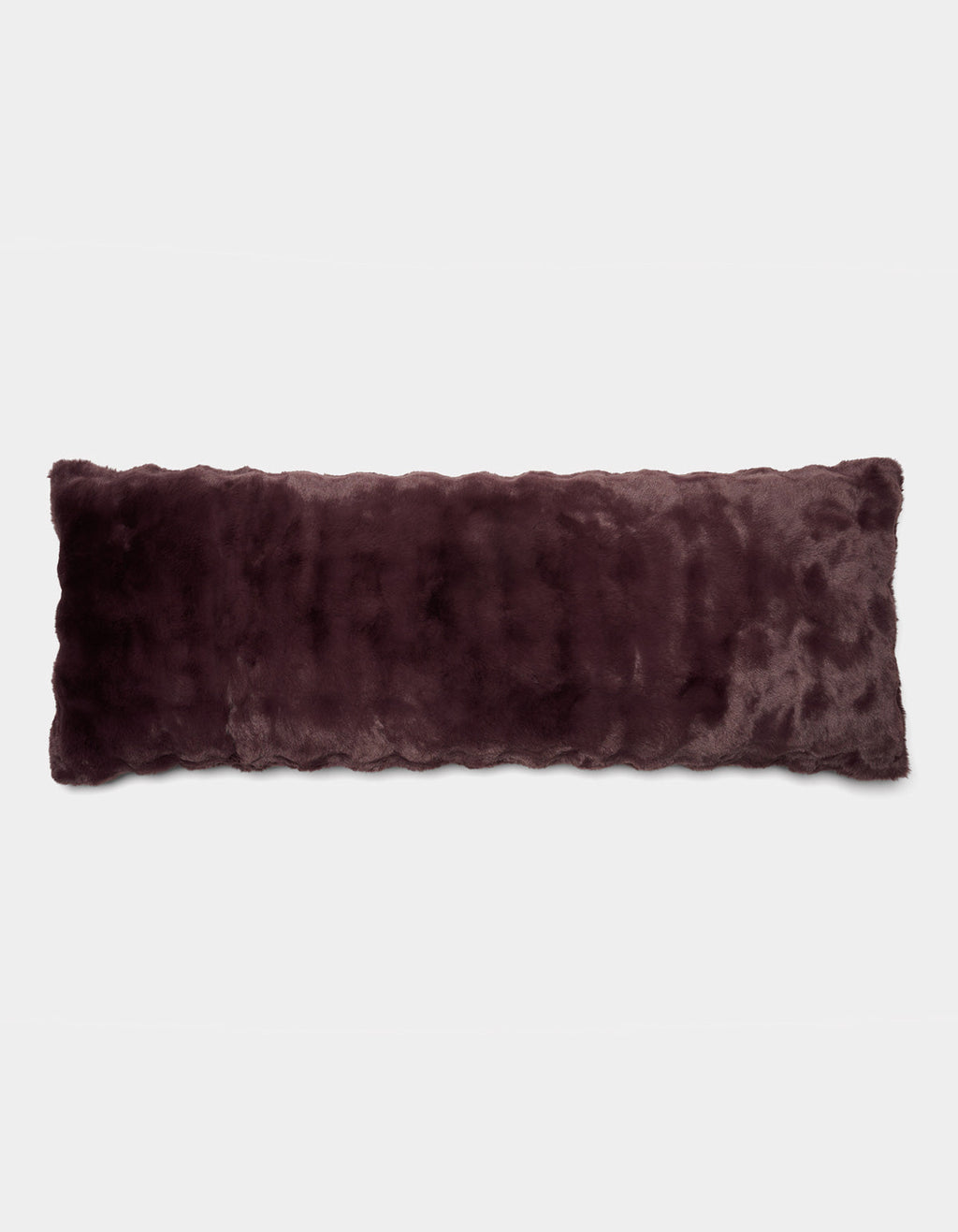 The Cozy Earth Bubble Cuddle Pillow, a long rectangular accent pillow in dark purple faux fur, is displayed against a plain white background.|Color:Raisin |Size:Body - 20" x 54"