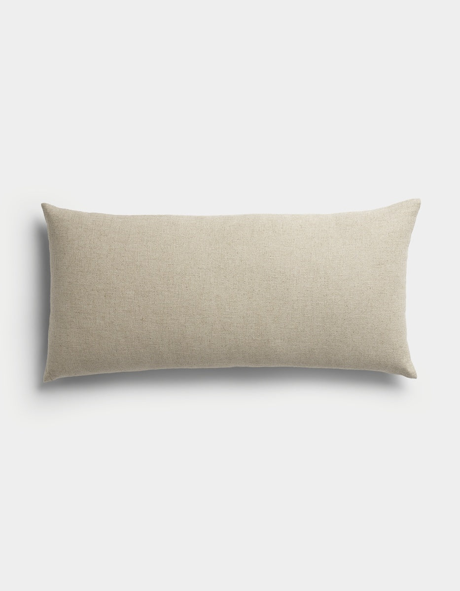 The Sonoma Throw Pillow by Cozy Earth is a rectangular, beige accent pillow featuring a smooth fabric texture, displayed against a plain white background.|Color:Tallow|Size:14" x 30"