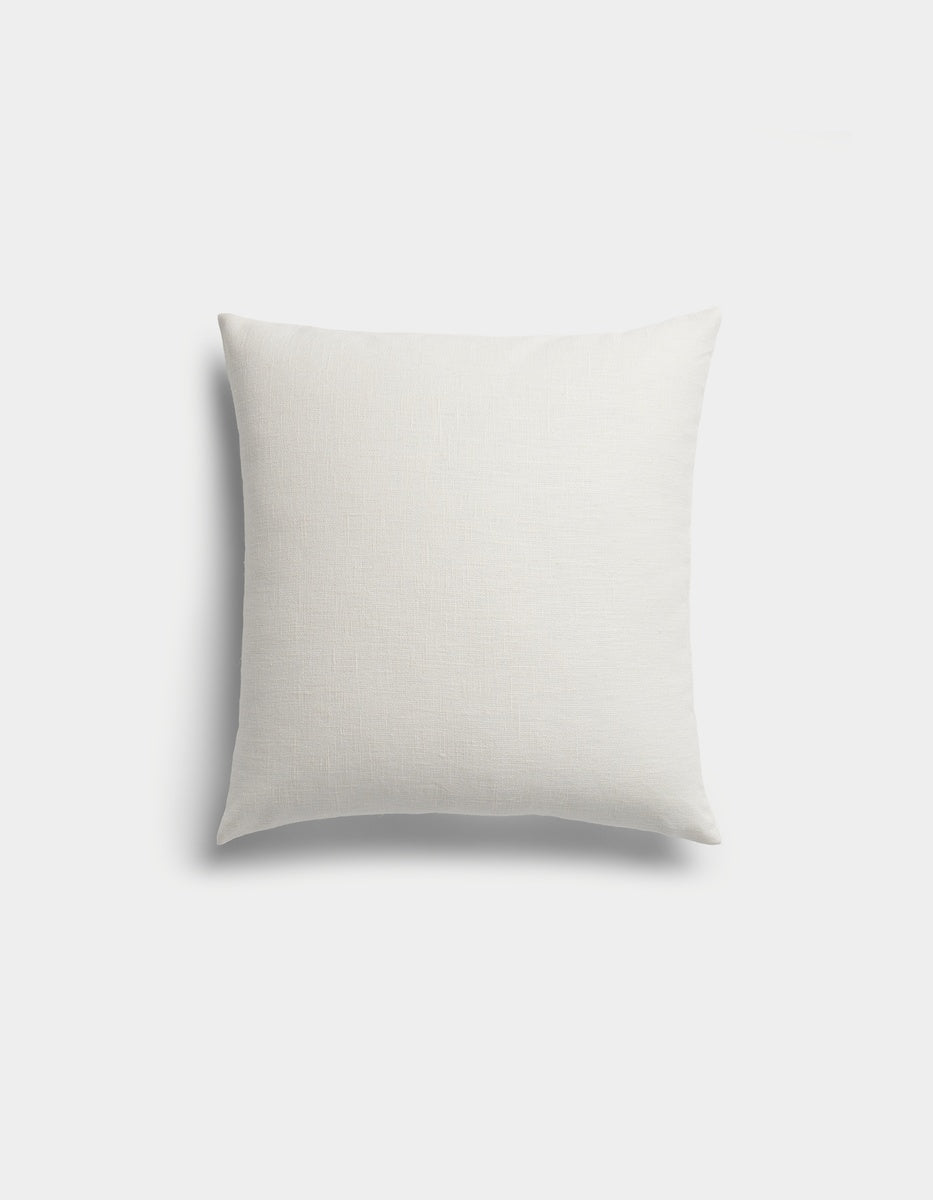 The Sonoma Throw Pillow by Cozy Earth is a plain, square white pillow with a subtle texture, displayed against a light gray background.|Color:Sea Salt|Size:20" x 20"
