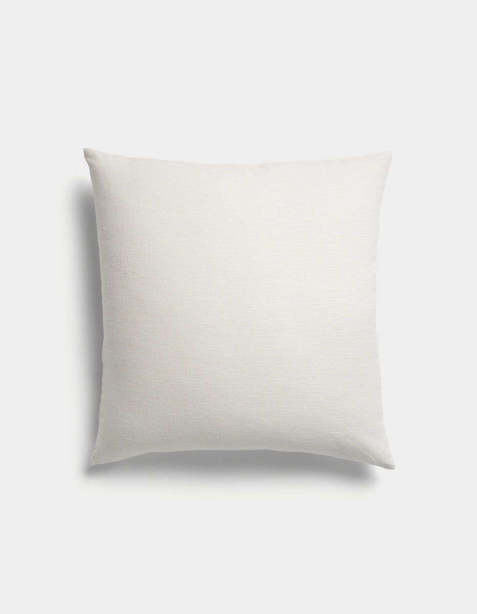 The Sonoma Throw Pillow by Cozy Earth is a plain, square white pillow featuring a simple fabric texture, photographed against a plain white background.|Color:Sea Salt|Size:24" x 24"