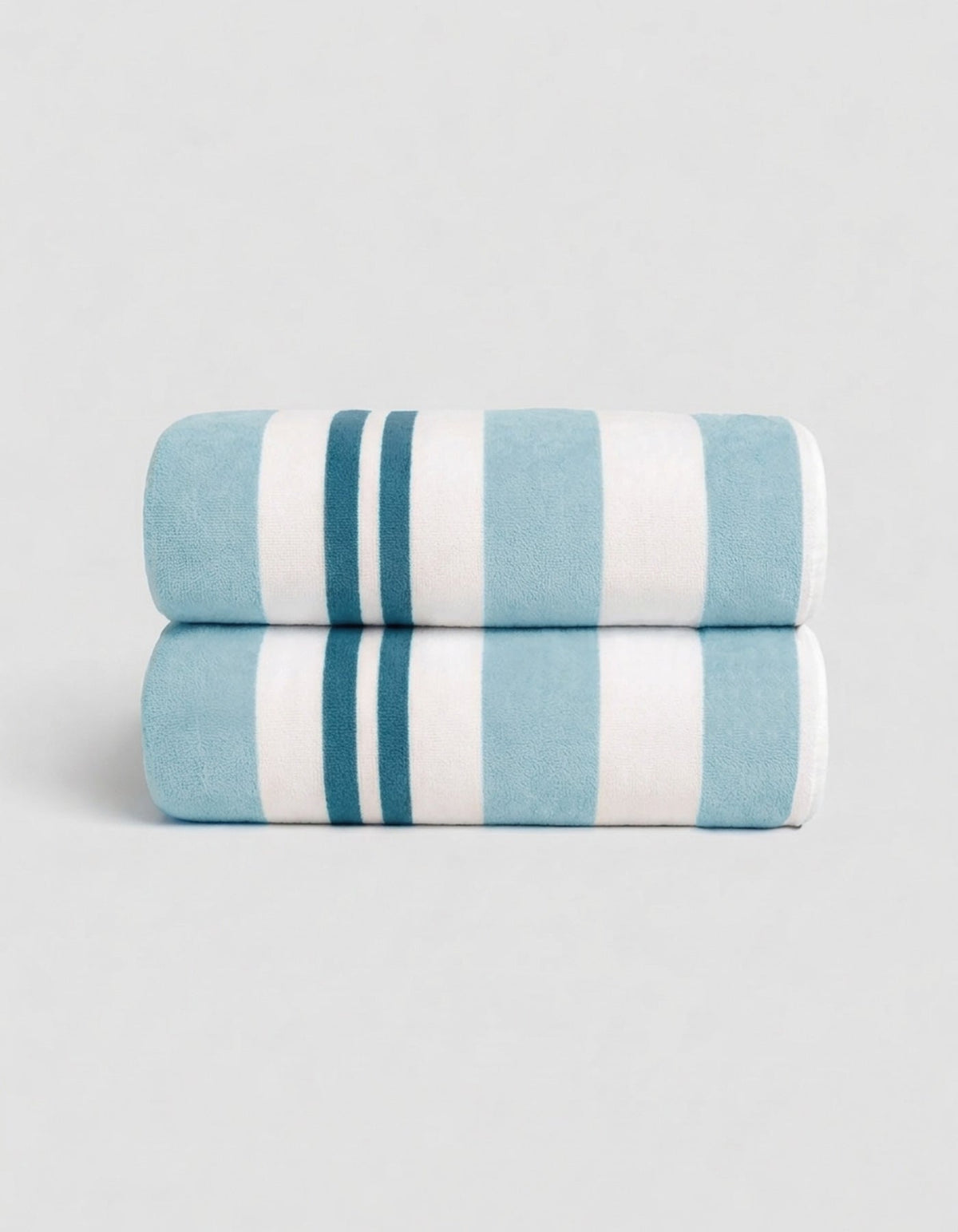 The Cozy Earth Classic Stripe Resort Towel Bundle in Wave Stripe features two neatly folded towels, stacked together, with bold blue and white stripes against a simple light background.|Color:Wave Stripe